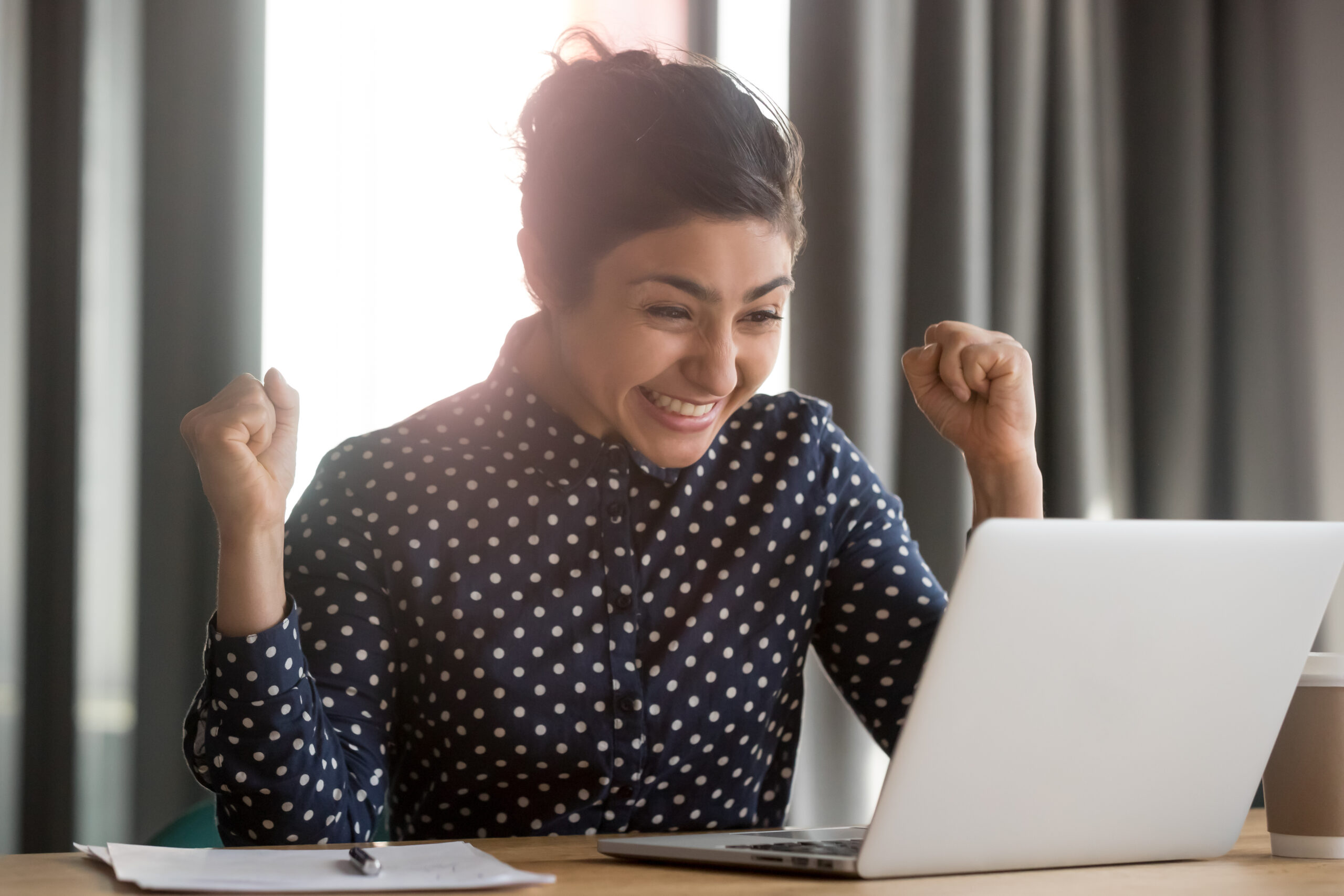 Excited Woman on Laptop Computer
